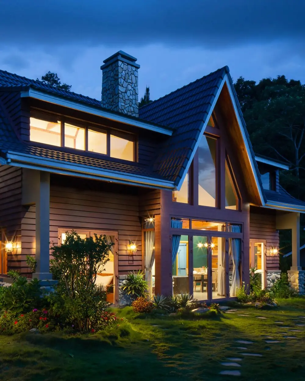 A warmly lit family home at dusk